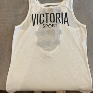 Medium Victoria Sport white tank top with stipe opening in back